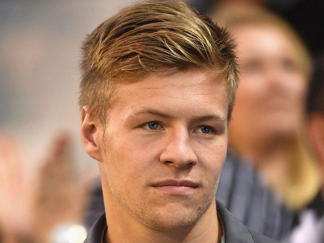 MELBOURNE, AUSTRALIA - MARCH 24:  Jordan De Goey of the Magpies watches on from the sidelines during the round one AFL match between the Collingwood Magpies and the Western Bulldogs at Melbourne Cricket Ground on March 24, 2017 in Melbourne, Australia.  (Photo by Quinn Rooney/Getty Images)