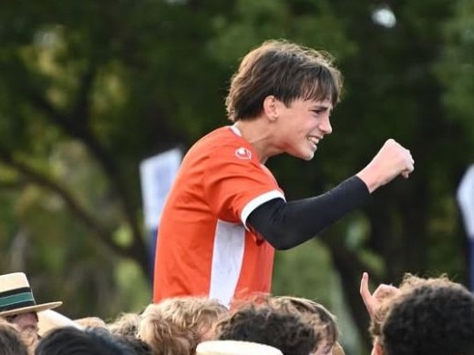BBC goal keeper Isaac Taylor lifted up by supporters.