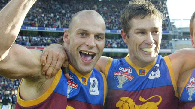 Martin Pike, Alastair Lynch and Justin Leppitsch celebrate their win. 2003 Grand Final. Collingwood v Brisbane Lions. MCG.
