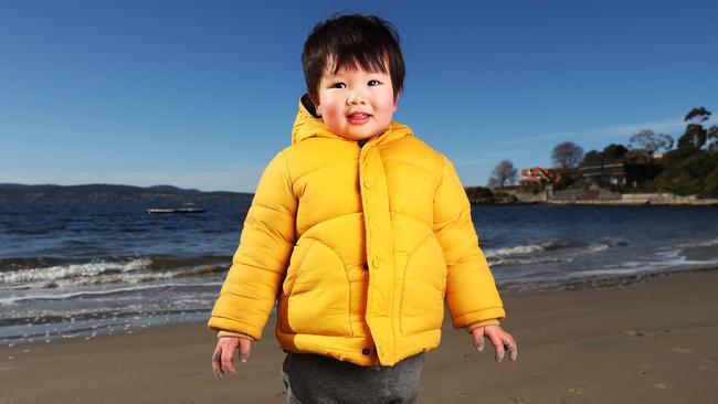 Finn Kou, 2, of Hobart, enjoying a day in the sand at Long Beach in Sandy Bay. Picture: Nikki Davis-Jones