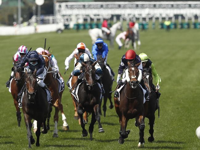 Hugh Bowman pulls up on Anthony Van Dyck in the background during 2020 Lexus Melbourne Cup.