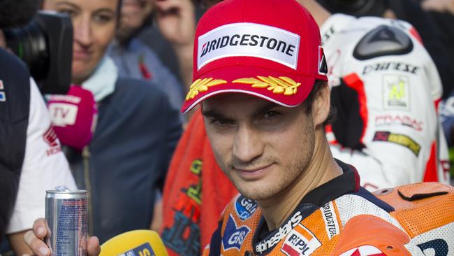 Repsol Honda's Spanish rider Dani Pedrosa celebrates the third position after the Moto GP qualifying session of the Valencia Grand Prix. Picture: AFP PHOTO/JAIME REINA