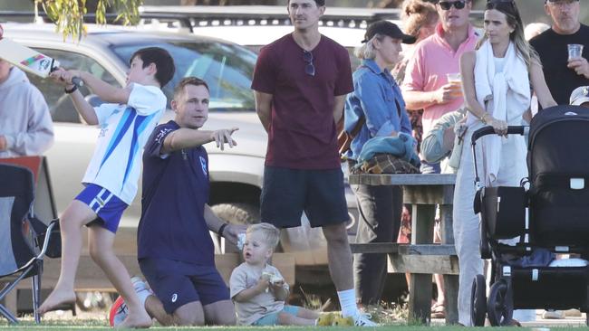 Joel Selwood on the sidelines with son Joey and wife Brit. Picture: Mark Wilson