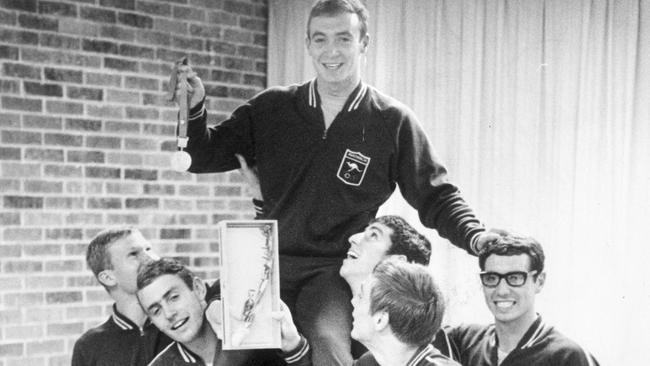 Michael Wenden celebrates his gold medal swim with his teammates.