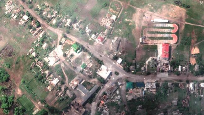 A satellite image shows damaged buildings and tank on the road in Lyman, Ukraine. Moscow-backed separatist forces captured the strategic town but Ukrainian forces retook it at the weekend. Picture: Maxar Technologies/AFP