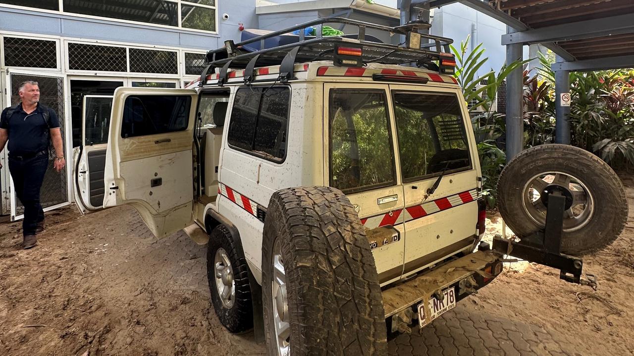 Torres and Cape Hospital and Health Service staff inspect a damaged vehicle at its clinic in the remote Indigenous community of Wujal Wujal in January.