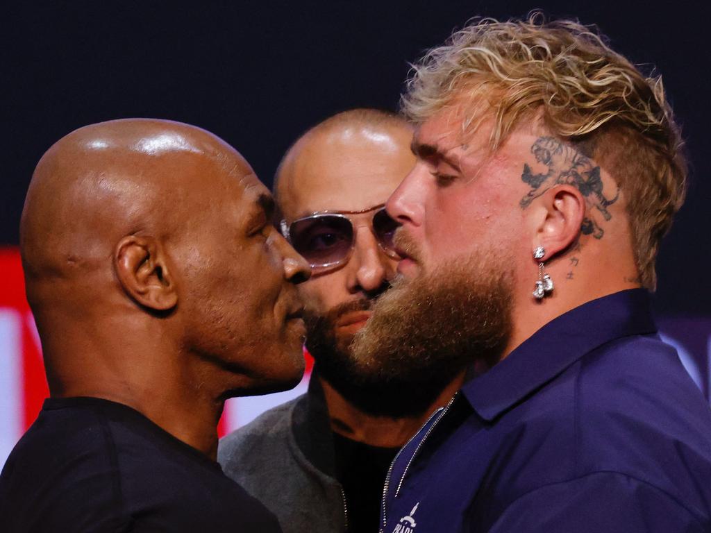 Mike Tyson (left) and Jake Paul face off on May 13, 2024. (Photo by Kena Betancur / AFP)