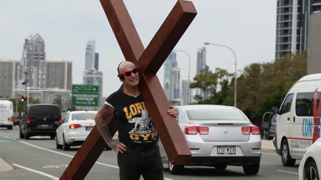 Kevin Mudford travels the countryside spreading the word of God and carrying a cross. Picture: Glenn Hampson