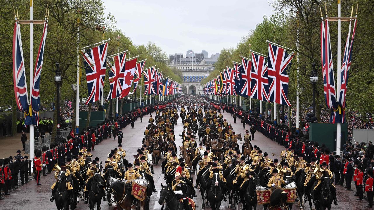 Members of the Household Cavalry Mounted Band lead the Coronation Procession back to Buckingham Palace from Westminster Abbey . Picture: AFP