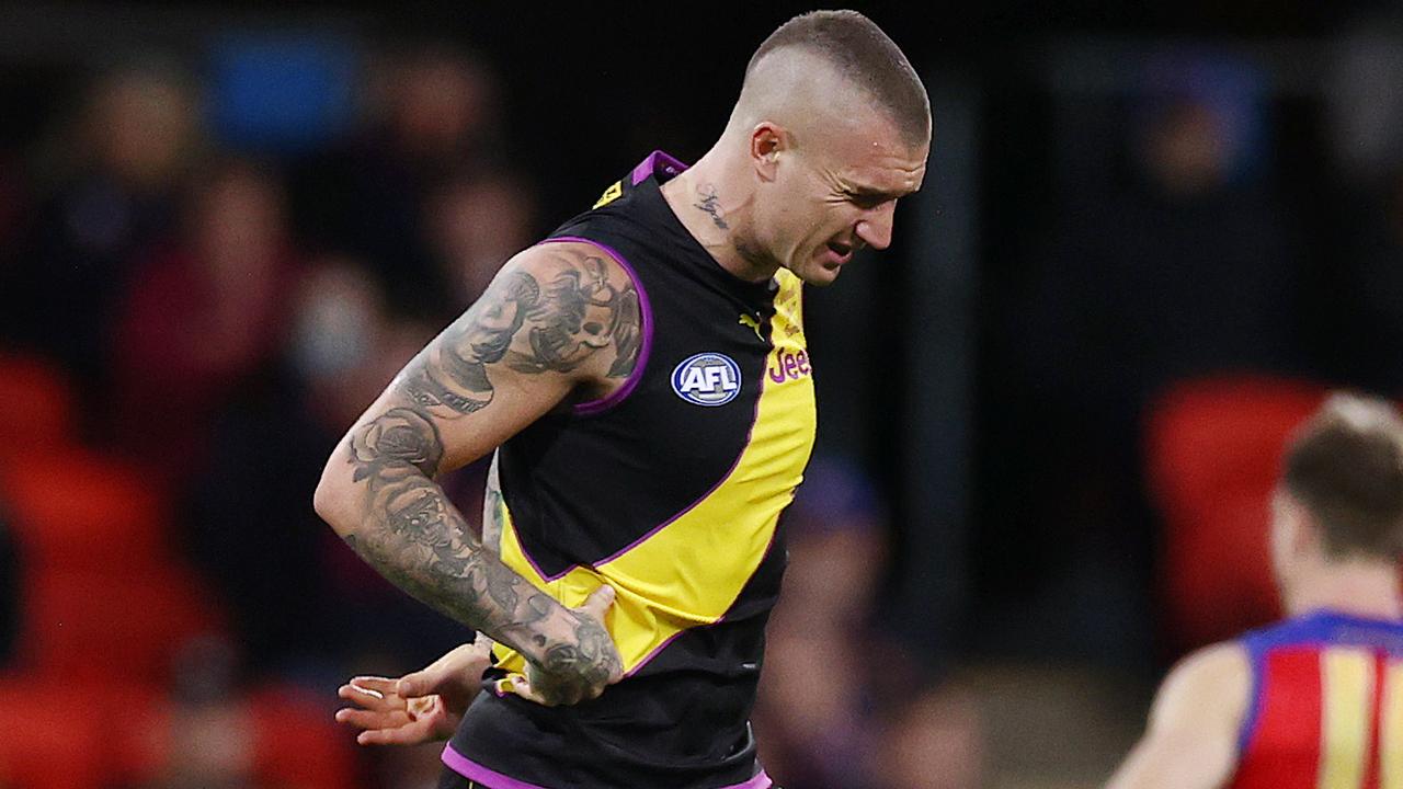 Dustin Martin grimaces in pain as he comes off with a kidney injury at Metricon Stadium in Round 18. Picture: Michael Klein