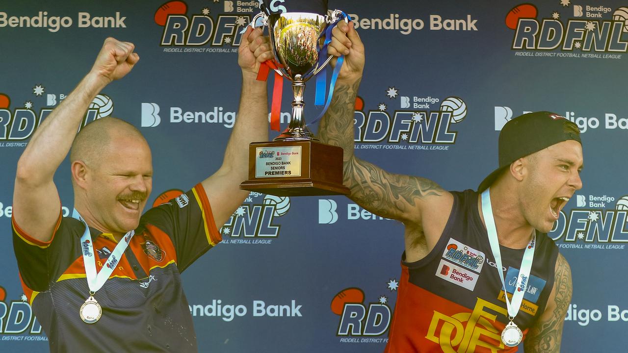 Jamie Lobb and Mitch Jensen lift the RDFNL premiership cup. Picture: Aaron Cook