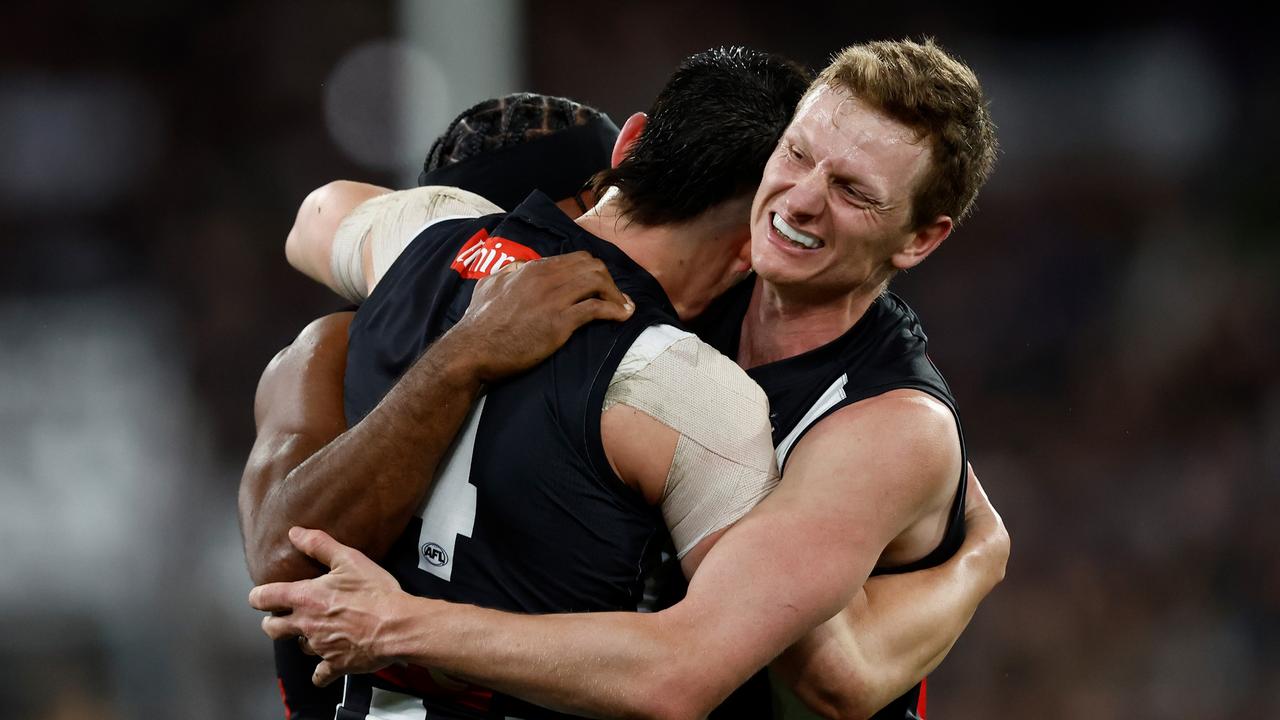 (L-R) Isaac Quaynor, Brayden Maynard and Will Hoskin-Elliott of the Magpies celebrate. Picture: Michael Willson/AFL Photos via Getty Images