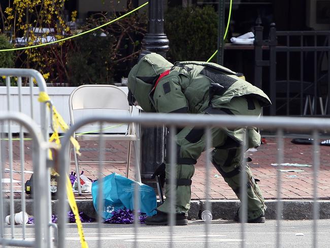 Bomb squad investigators examine a suspicious item after two bombs exploded during the Boston Marathon in 2013. Picture: Alex Trautwig/Getty Images/AFP