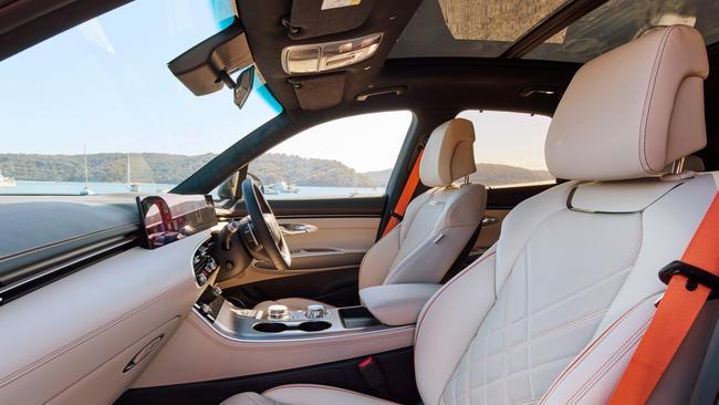 One of the Genesis GV70 Signature Sport interior colour options includes orange seatbelts.