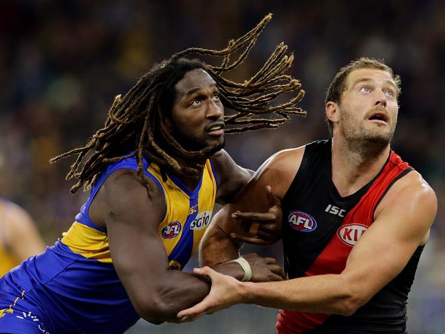 PERTH, WESTERN AUSTRALIA - JUNE 21:  Nic Naitanui of the Eagles contests a ruck with Tom Bellchambers of the Bombers during the round 14 AFL match between the West Coast Eagles and the Essendon Bombers at Optus Stadium on June 21, 2018 in Perth, Australia.  (Photo by Will Russell/AFL Media/Getty Images)