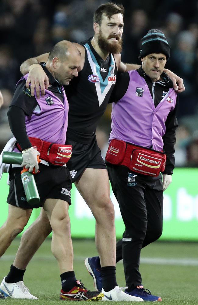 Charlie Dixon is helped off with an ankle injury last week. Picture: Sarah Reed