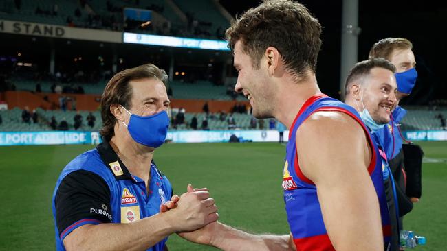 Luke Beveridge congratulates Josh Dunkley after the Bulldogs’ big win.