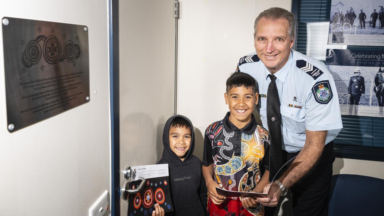 Oakey officer-in-charge Sergeant John Cook with Jarahl (left) and Jahmalakai Isaacs with the Look to the Stars plaque after the unveiling at the station during NAIDOC Week, Friday, July 8, 2022. Picture: Kevin Farmer