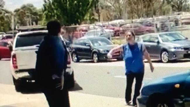 A woman hurls abuse at a man at Westfield Plenty Valley in Mill Park.