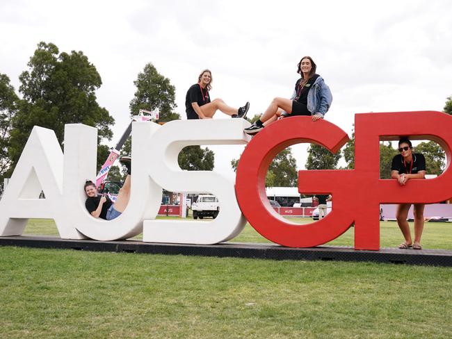 Workers pose after the cancellation of the Formula 1 Australian Grand Prix 2020 at the the Albert Park Circuit in Melbourne, Friday, March 13, 2020. (AAP Image/Michael Dodge) NO ARCHIVING, EDITORIAL USE ONLY