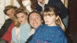 Robert Hughes (centre) with then child actor Sarah Monahan on his lap and other cast members of the sitcom Hey Dad!