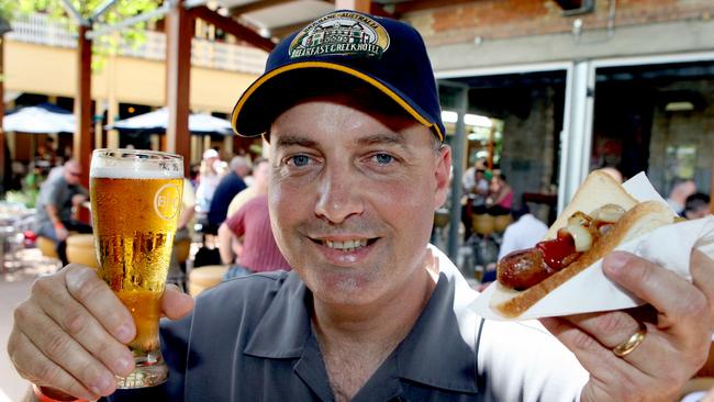 USS Ronald Reagan crew enjoy Australia Day at Breakfast Creek hotel: Command Master Chief Jim DeLozier with beer and snag in 2006. Picture: Peter Bull