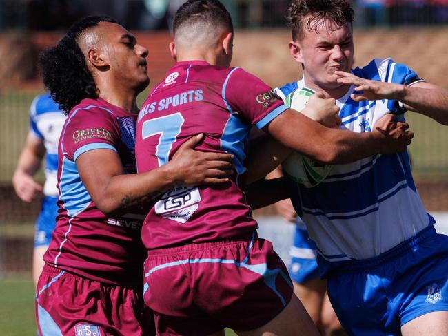 DAILY TELEGRAPH AUGUST 16, 2023Hills Sports High (maroon) versus St Dominics in the NRL School Boys Competition at Windsor today. Pictured is Key Raven with the ball. Picture: David Swift.