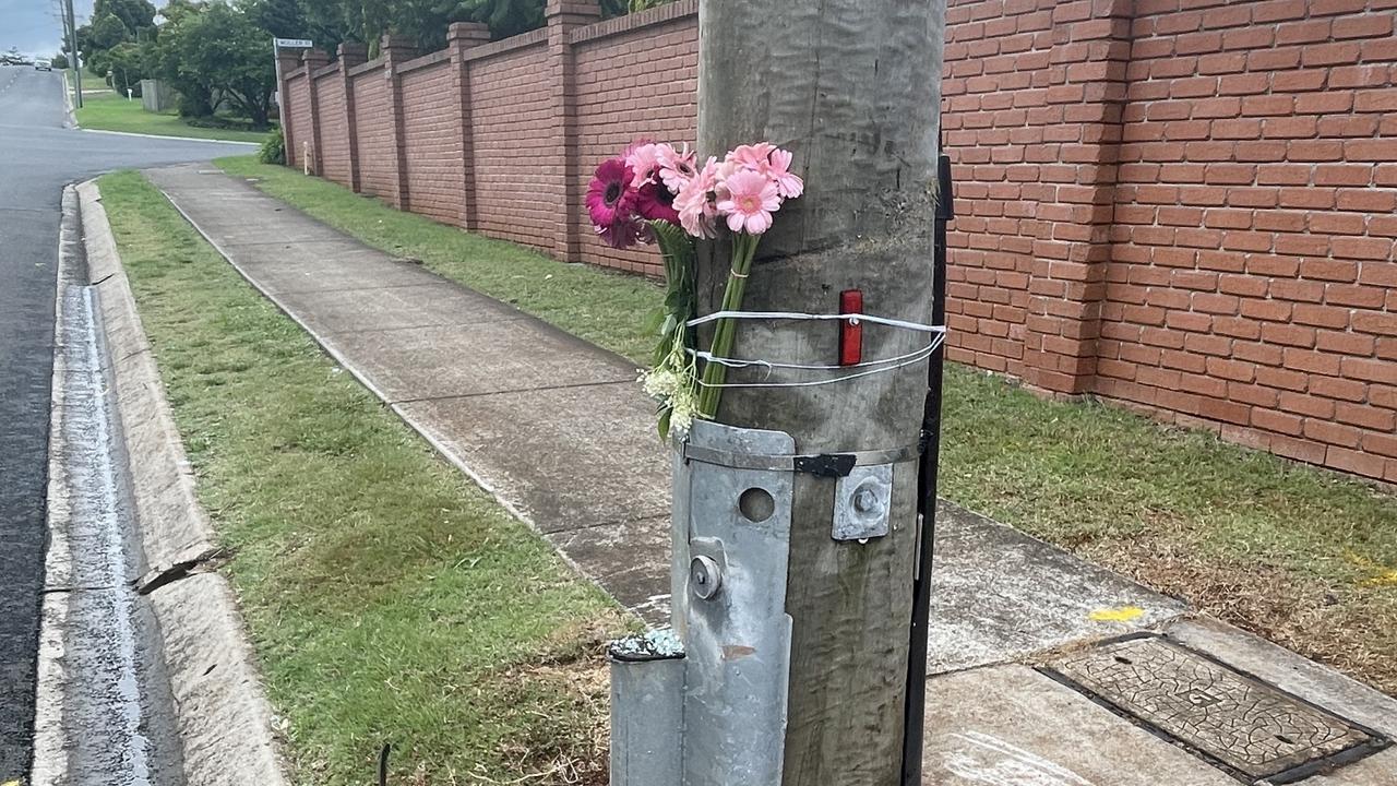 Flowers tied to the pole where a tragic crash occurred. Condolences and grief have poured out after the devastating loss of 22-year-old Abul Deng on Saturday night after a tragic crash in Kearneys Spring.