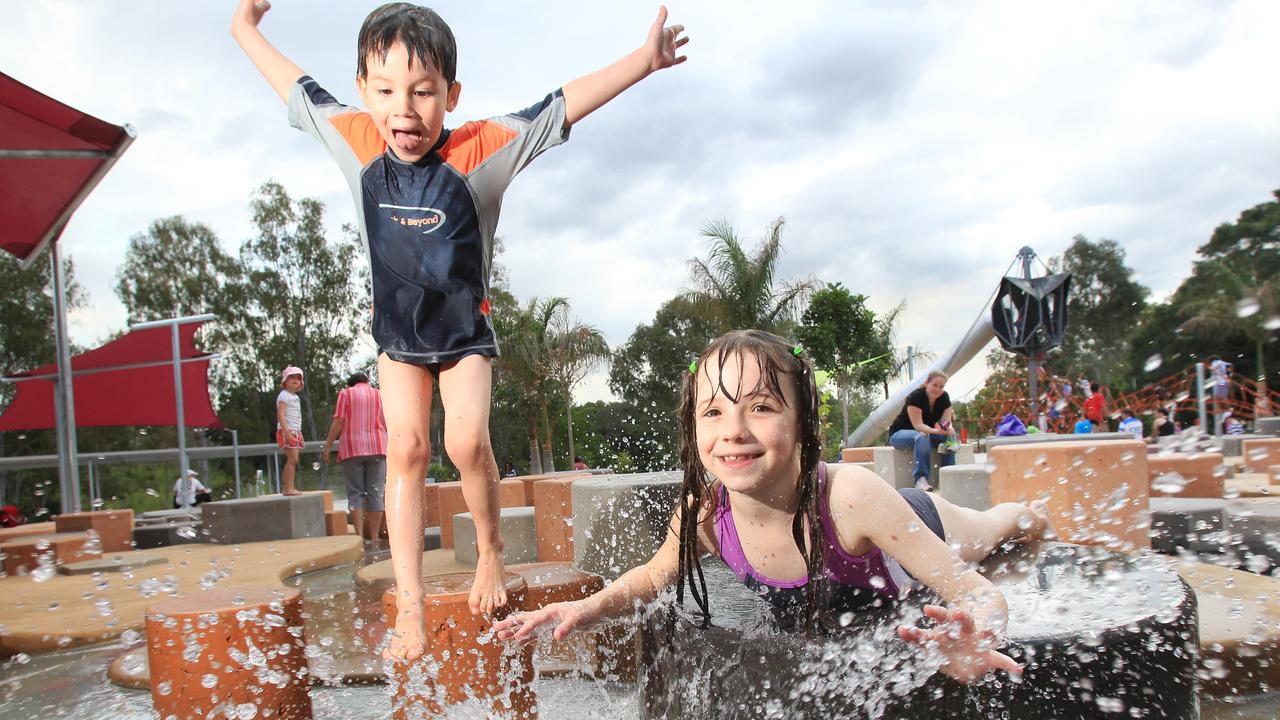 Luke and sister Katelyn Trost from Brassall enjoy the water park of Bob Gamble Park, as a part of Ipswich River Heart Parklands. Photo Steve Pohlner