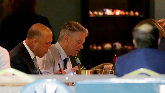 Peter Dutton and Mathias Cormann having dinner at Portia's Place restaurant in Kingston last night. Picture: Jonathan Ng