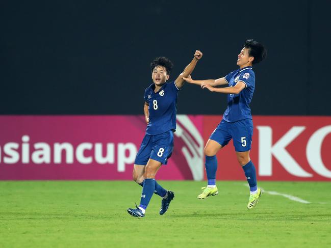 Nipawan Panyosuk (left) celebrates scoring against the Matildas with her Thailand teammate Amornrat Utchai. Picture: Thananuwat Srirasant/Getty Images