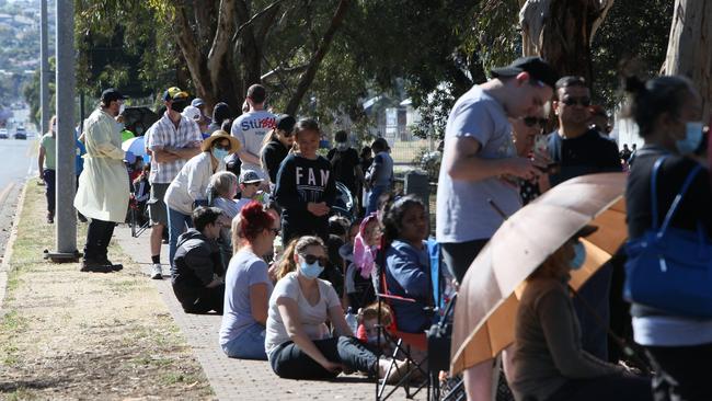 People are turning out in their thousands to coronavirus testing clinics across the city, including huge lines at the Parafield Airport testing tent. Picture: Emma Brasier