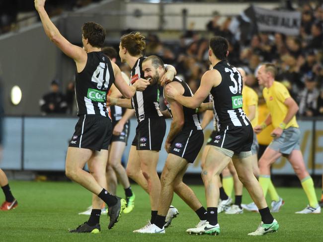 Collingwood celebrates on the final siren. Picture: Tony Gough