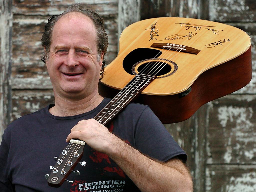 Michael with a signed guitar given to him by the members of The Eagles.