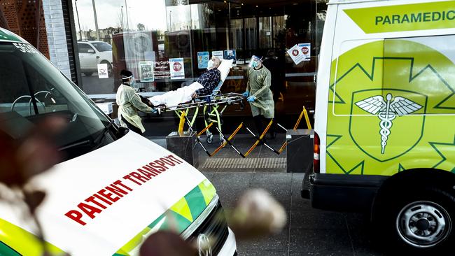 A resident of Epping Gardens is taken away in an ambulance on Tuesday. Picture: Getty