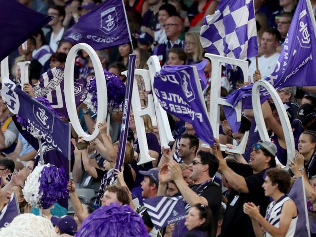 Dockers fans cheer during the Round 2 AFL match between the Fremantle Dockers and the Essendon Bombers at Optus Stadium in Perth, Saturday, March 31, 2018. (AAP Image/Richard Wainwright) NO ARCHIVING, EDITORIAL USE ONLY