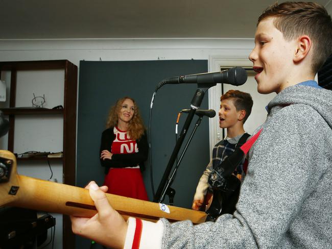 Stephanie Bourke looks on as twins Hudson and Xavier Mitchell -11 play. Picture: John Appleyard