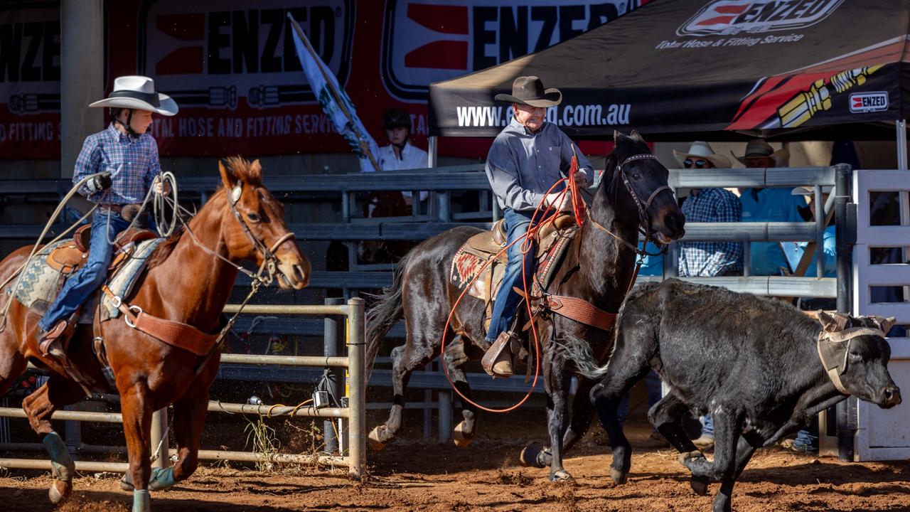 Mount Isa Rodeo 2024 - Bob Holder, 93, and Tate Smith, 9, competing in the team roping at the Mount Isa Rodeo in 2024. Picture by Luke Marsden.