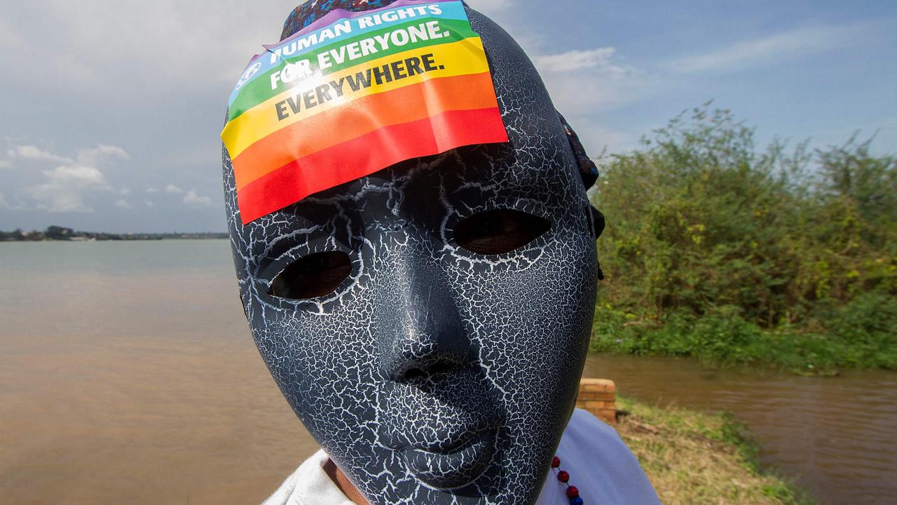 A Ugandan wearing a mask takes part in the Gay Pride parade in Entebbe in 2015. Picture: AFP