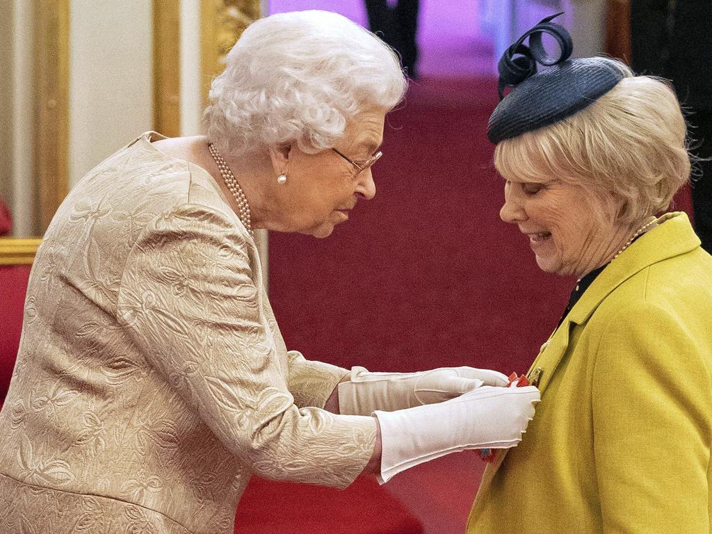 Britain's Queen Elizabeth wore gloves at a recent ceremony for the first time in more than a decade following health advice. Picture: Dominic Lipinski/PA via AP.