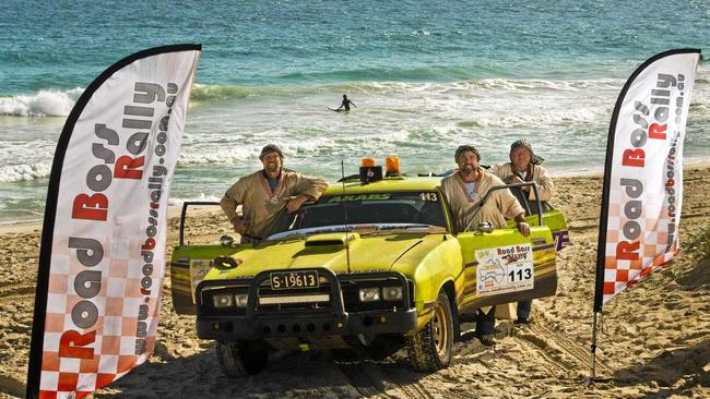 WINNERS: Pulling up their car named The Hulk on Scarborough beach in Western Australia are (from left) Brad Hudson, Shayne Moore and Lionel Moore. Picture: Nev Madsen