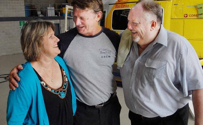 Vicki and Tony Wilson, who were involved in a fatal crash near Carmila on May 2 last year, express their gratitude to RACQ-CQ Rescue pilot Brendon Barron, who represented the service as the couple handed over a $10,000 thank you donation. The pilot on the day was Alex Crawford. Picture: Peter Holt