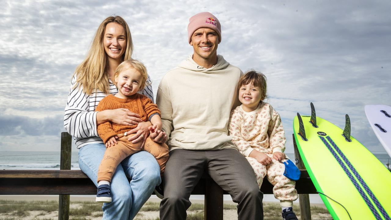 Pro surfer Julian Wilson with wife Ashley and children River 18 months, and Olivia 3, back in his hometown in Coolum Beach before heading to the Tokyo Olympics. Picture Lachie Millard