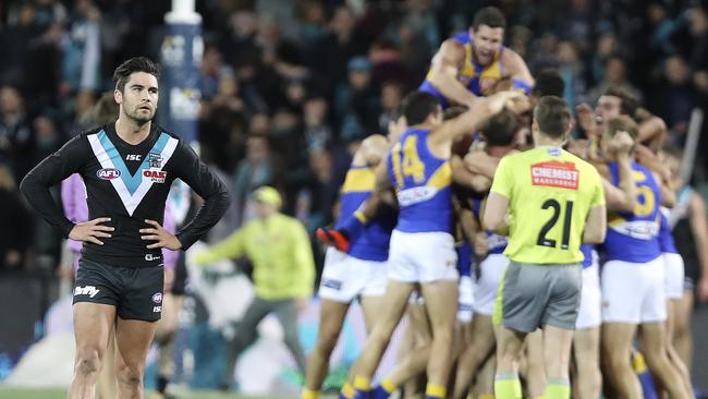 Chad Wingard stands in disbelief as Eagles players celebrate. Picture: Sarah Reed