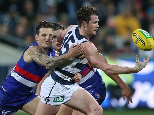 Patrick Dangerfield beats Clay Smith to the ball. Picture:Wayne Ludbey