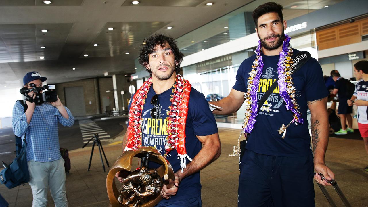 Johnathan Thurston, and James Tamou of the North Queensland Cowboys pictured at Sydney airport with the Premiership Trophy after winning the 2015 NRL Grand Final against Brisbane Broncos. Picture: Braden Fastier