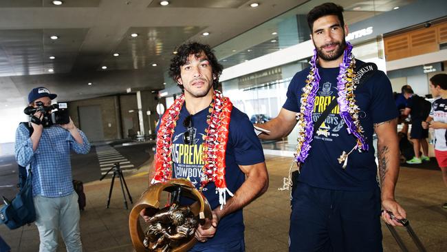 Johnathan Thurston, and James Tamou of the North Queensland Cowboys pictured at Sydney airport with the Premiership Trophy after winning the 2015 NRL Grand Final against Brisbane Broncos. Picture: Braden Fastier