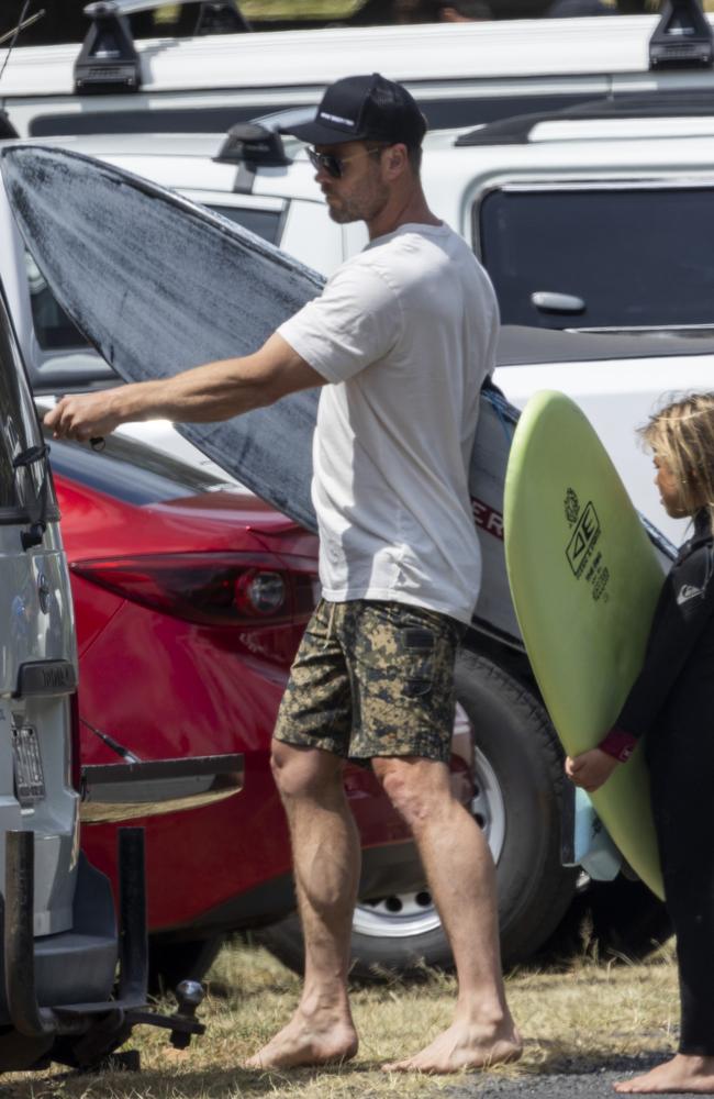 After catching some waves with his sons, Hemsworth dried off with a sandy towel, and changed into a loose-fitting white T-shirt and discreet black cap. Picture: Media Mode