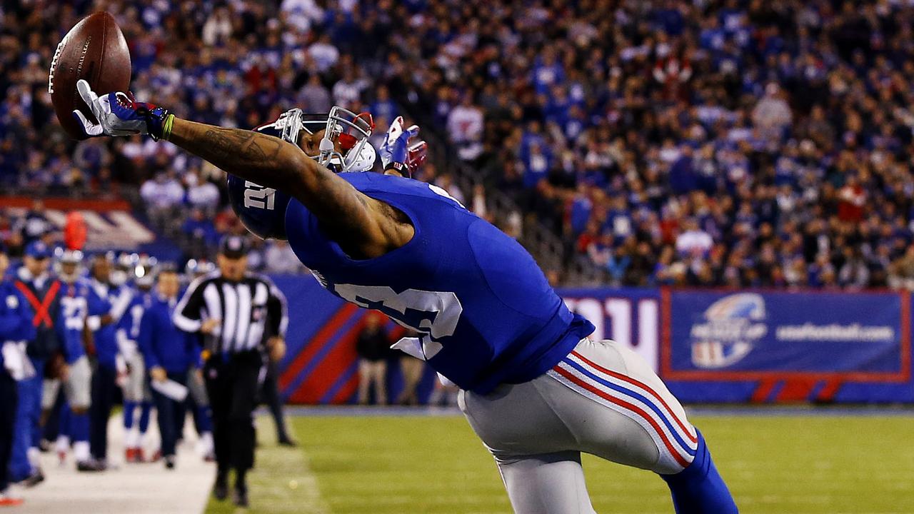 EAST RUTHERFORD, NJ - NOVEMBER 23: Odell Beckham #13 of the New York Giants scores a touchdown in the second quarter against the Dallas Cowboys at MetLife Stadium on November 23, 2014 in East Rutherford, New Jersey. (Photo by Al Bello/Getty Images)