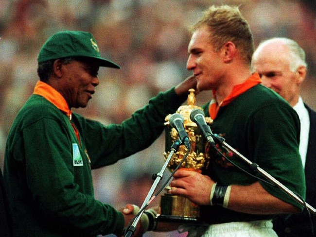 The iconic picture of then South African President Nelson Mandela (L) presenting the William Webb Ellis Cup trophy to Springboks captain Francois Pienaar after the 1995 World Cup final at Ellis Park in Johannesburg. Picture: AFP